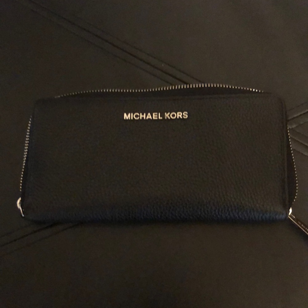 Michael Kors black and silver zip wallet.